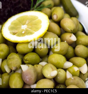Green olives without seeds, stuffed with the garlic cloves Stock Photo