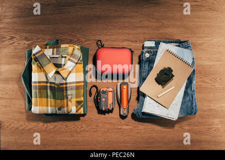 top view of travel items set on wooden table Stock Photo