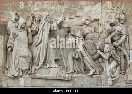Saint Sergius of Radonezh blesses Grand Prince Dmitry Donskoy of Moscow in the Trinity Monastery before the Battle of Kulikovo against the Tatars in 1380 depicted in the original marble high relief by Russian sculptor Alexander Loganovsky (1847-1849) from the Cathedral of Christ the Saviour, now on display in the Donskoy Monastery in Moscow, Russia. Russian monks Rodion Oslyabya and Alexander Peresvet are depicted in the left and Russian military commanders Prince Dmitry Bobrok and Prince Vladimir the Bold of Serpukhov are depicted in the right. Stock Photo