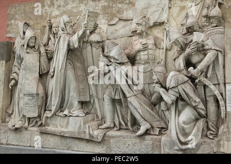 Saint Sergius of Radonezh blesses Grand Prince Dmitry Donskoy of Moscow in the Trinity Monastery before the Battle of Kulikovo against the Tatars in 1380 depicted in the original marble high relief by Russian sculptor Alexander Loganovsky (1847-1849) from the Cathedral of Christ the Saviour, now on display in the Donskoy Monastery in Moscow, Russia. Russian monks Rodion Oslyabya and Alexander Peresvet are depicted in the left and Russian military commanders Prince Dmitry Bobrok and Prince Vladimir the Bold of Serpukhov are depicted in the right. Stock Photo