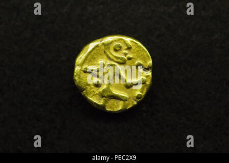 Celtic warrior depicted in the Celtic golden coin on display at the exhibition devoted to the Celts in the National Museum (Národní muzeum) in Prague, Czech Republic. Celtic golden coins of this type dated from 250-120 BC from Czech and Moravian finds are known as the Bohemian 'local issue' coins. The exhibition presenting the Iron Age artefacts of the La Tène culture runs till 24 February 2019. Stock Photo