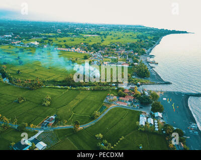 Aerial drone view of the beautiful green coastline in Bali, Indonesia. Stock Photo