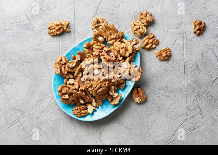 Walnut kernels on gray background. Stock Photo