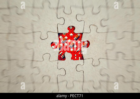 Missing jigsaw puzzle piece and red rose inside. Abstract conceptual image Stock Photo
