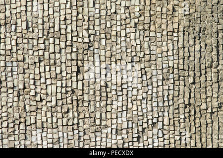 Old weathered stone mosaic texture. Natural wall finishing material Stock Photo