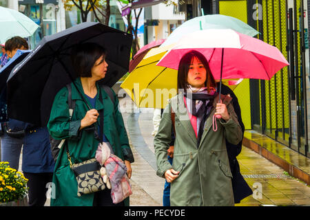 South Koreans with Umbrellas on Rainy Day Busan Pusan South Korea Asia Stock Photo