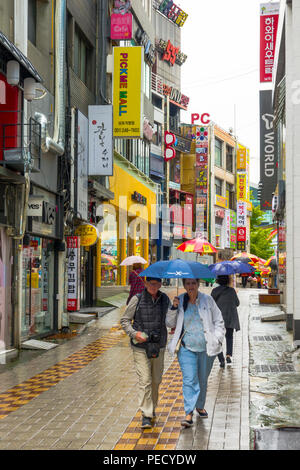 South Koreans with Umbrellas on Rainy Day Busan Pusan South Korea Asia Stock Photo