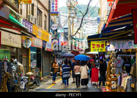 South Koreans with Umbrellas on Rainy Day Busan Pusan South Korea Asia Stock Photo