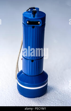 Blue torch isolated on blue and white gradient Stock Photo