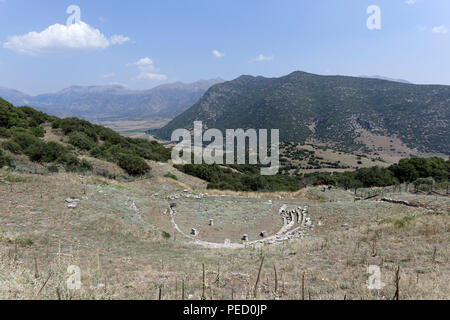 The Ancient Greek theatre at an altitude of 800 metres provides a spectacular view of the valley of Kandila.  Orchomenos, Peloponnese, Greece. Founded Stock Photo