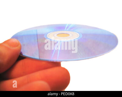 Mans hand holding compact disc on the finger isolated Stock Photo