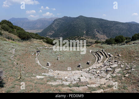 The Ancient Greek theatre at an altitude of 800 metres provides a spectacular view of the valley of Kandila.  Orchomenos, Peloponnese, Greece. Founded Stock Photo