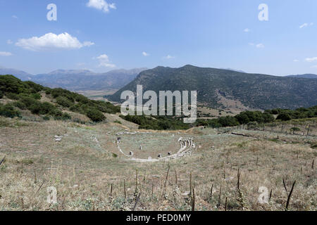 The Ancient Greek theatre at an altitude of 800 metres provides a spectacular view of the valley of Kandila.  Orchomenos, Peloponnese, Greece. Founded Stock Photo