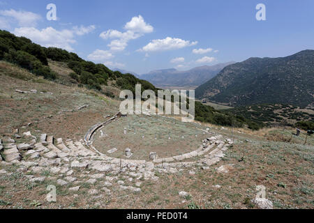 The Ancient Greek theatre at an altitude of 800 metres provides a spectacular view of the valley of Kandila.  Orchomenos, Peloponnese, Greece. Founded Stock Photo