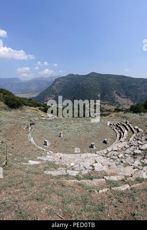 The Ancient Greek theatre at an altitude of 800 metres provides a spectacular view of the valley of Kandila.  Orchomenos, Peloponnese, Greece. Founded Stock Photo