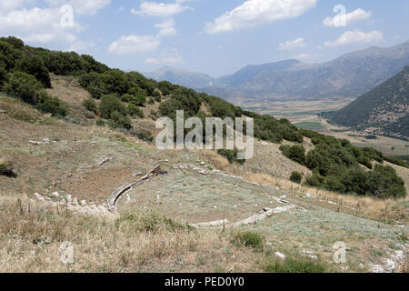 The Ancient Greek theatre at an altitude of 800 metres provides a spectacular view of the valley of Kandila.  Orchomenos, Peloponnese, Greece. Founded Stock Photo