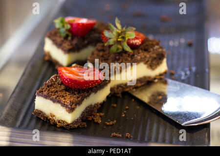 Curd chocolate cakes with fresh strawberries on tray Stock Photo