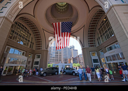 Archway and flag at the famous Boston Harbor Hotel, Rowes Wharf, Boston, Suffolk County, Massachusetts, USA Stock Photo