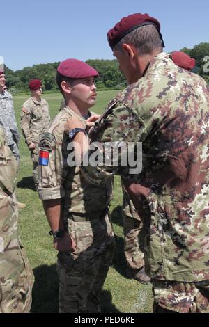 https://l450v.alamy.com/450v/ped6ke/an-italian-jumpmaster-pins-italian-wings-on-united-kingdom-paratrooper-sgt-owen-jones-from-the-7th-para-royal-horse-artillery-during-the-wing-exchange-ceremony-for-completing-a-jump-with-an-italian-jumpmaster-aug-3-2015-leapfest-is-an-international-parachute-competition-hosted-by-the-56th-troop-command-rhode-island-national-guard-to-promote-high-level-technical-training-and-esprit-de-corps-within-the-international-airborne-community-us-army-photo-by-sgt-1st-class-horace-murrayreleased-ped6ke.jpg