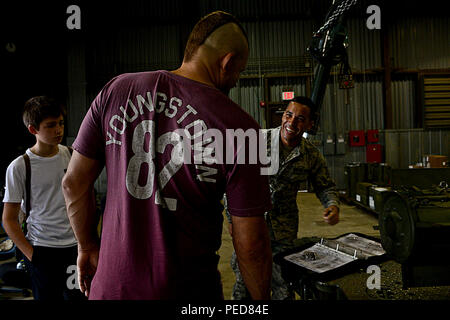 Chuck “The Iceman” Liddell, retired American mixed martial artist, speaks with Staff Sgt. Corey Rodriguez, 51st Munitions Squadron tech inspections crew chief on Osan Air Base, South Korea, Aug. 5, 2015. Liddell and his family visited various units during a morale trip. Liddell is a former Ultimate Fighting Championship light heavyweight champion. He has an extensive striking background in Kempo, Koei-Kan karate and kickboxing, as well as a grappling background in collegiate wrestling and Brazilian Jiu-Jitsu. Liddell, fighting 23 times, holds the record with the most knockouts in Ultimate Figh Stock Photo