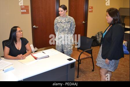 The Honorable Debra S. Wada, Assistant Secretary of the Army, Manpower & Reserve Affairs (right), speaks to Reelana Gonzales, 314th Combat Sustainment Support Battalion, staff operations training specialist, Sgt. Talena Baker, 314th CSSB human resource specialist during her visited to the George W. Dunaway Army Reserve Center, in Sloan, Nev., Aug. 7. Stock Photo