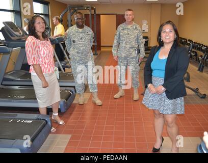 The Honorable Debra S. Wada, Assistant Secretary of the Army, Manpower & Reserve Affairs (right), Supervisory Staff Administrator Ms. Teresa M. Gonzalez, Command Sgt. Maj. Grady Blue, 311th ESC command sergeant major and Col. Scott Linton, 311th Expeditionary Sustainment Command chief of staff, tour the gym at the George W. Dunaway Army Reserve Center, in Sloan, Nevada Aug. 7. Stock Photo