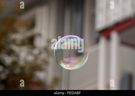 Single soap bubble against bright background Stock Photo