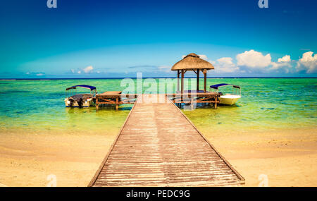 Sandy tropical Wolmar beach at sunny day. Jetty on the foreground. Beautiful landscape. Mauritius Stock Photo