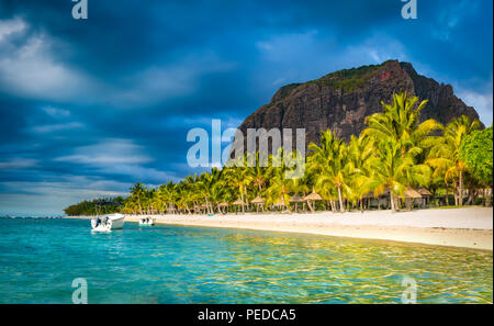 White sandy beach and Le Morn Brabant at sunset.  Beautiful  Mauritius landscape. Stock Photo