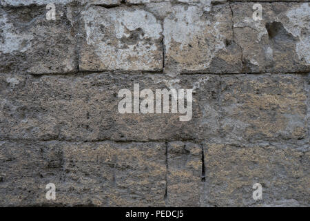 Old brick wall of loose shell rock. For network and design Stock Photo