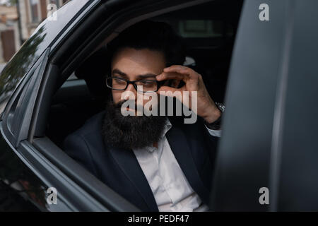 Close up portrair attractive young businessman in a car Stock Photo