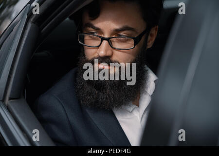 Close up portrair attractive young businessman in a car Stock Photo