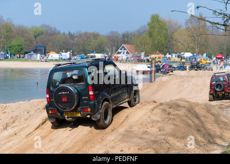 OLDENZAAL NETHERLANDS - APRIL 9, 2017: People having fun in an offroad car during an annual event Stock Photo