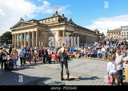 Sword swallower, Slug, from Tasmiania, performing by the Royal Scottish Academy on the Mound, in Edinburgh's Fringe Festival 2018, in Scotland, UK Stock Photo