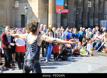 Sword swallower, Slug, from Tasmiania, performing by the Royal Scottish Academy on the Mound, in Edinburgh's Fringe Festival 2018, in Scotland, UK Stock Photo