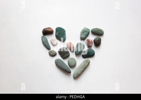 Sea stones heart shaped valentine isolated on white background Stock Photo
