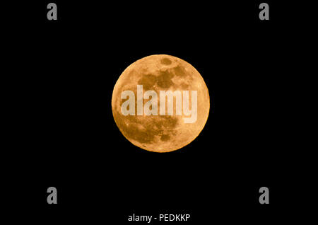 The yellow full moon on black background Stock Photo
