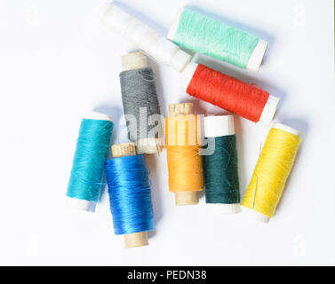 color threads for sewing on a white textured background 2018 Stock Photo