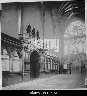 Black and white photograph showing an interior view, looking toward the south door and windows of the Memorial Transept at Memorial Hall, a late 19th-century Gothic revival building built to honor Harvard men who died in the Civil War, located north of Harvard Yard in Cambridge Massachusetts, 1875. Courtesy Internet Archive. () Stock Photo