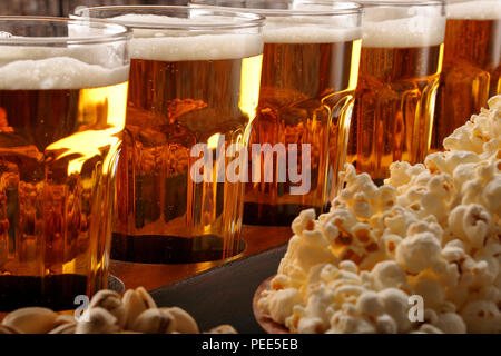 Beer row and snacks on wooden background football fan set Stock Photo