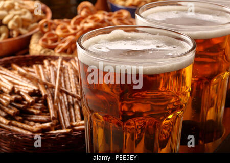 Beer row and snacks on wooden background football fan set Stock Photo