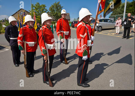 World War One living history reenactors soldiers of the South Wales Borderers 24th Regiment of Foot with the regimental colours at Hay-on-Wye Powys Wales UK Stock Photo