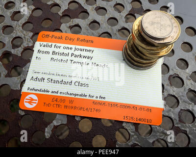 Off-peak day return rail tickets and money. Stock Photo