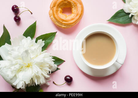 Notepad for text white flowers peony cherry berries on pastel pink background. Stock Photo