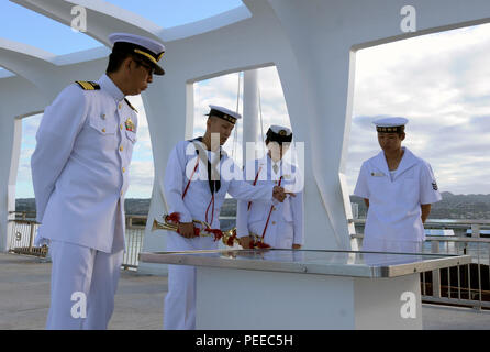 150804-N-ZQ784-025 PEARL HARBOR (August 04, 2015) Japanese sailors assigned to Japan Maritime Self-Defense Force helicopter destroyer JS Hyuga (DDH 181), destroyer JS Ashigara (DDG 178) and amphibious tank landing ship JS Kunisaki (LST 4003) tour the USS Arizona Memorial after a wreath-laying ceremony during a scheduled port visit at Joint Base Pearl Harbor-Hickam. The ceremony was meant to pay respect to those who lost their lives during the attack on Pearl Harbor, Dec. 7, 1941. JDMSF ships are scheduled to participate in the multilateral exercise Dawn Blitz 2015 in San Diego. Dawn Blitz is a Stock Photo