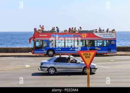 Transtur, Habana Bus Tour hop on hop off double decker tourist bus taking tourists sightseeing along the Malecon, Havana, Cuba Stock Photo