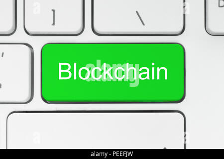 Blockchain concept. Green button with Blockchain word on the keyboard close-up Stock Photo