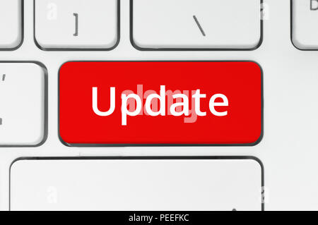 Red button with Update word on the keyboard close-up Stock Photo