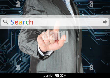 Businessman pushing virtual search bar with color Search word on digital background Stock Photo