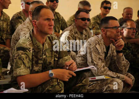 Brigadier Charlie Stickland RM (Left) observes the terrain model with Brigadier General Robert F. Castellvi (Right) at a rehearsal of concept drill at Camp Wilson aboard Marine Corps Air Ground Combat Center, Calif., in support of the 2d MEB Large Scale Exercise Aug. 12, 2015. LSE is a combined U.S. Marine Corps, Canadian, and British exercise conducted at the Brigade-level, designed to enable live, virtual and constructive training for participating forces. (U.S. Marine Corps photo by Cpl. Tyler A. Andersen/Released) Stock Photo